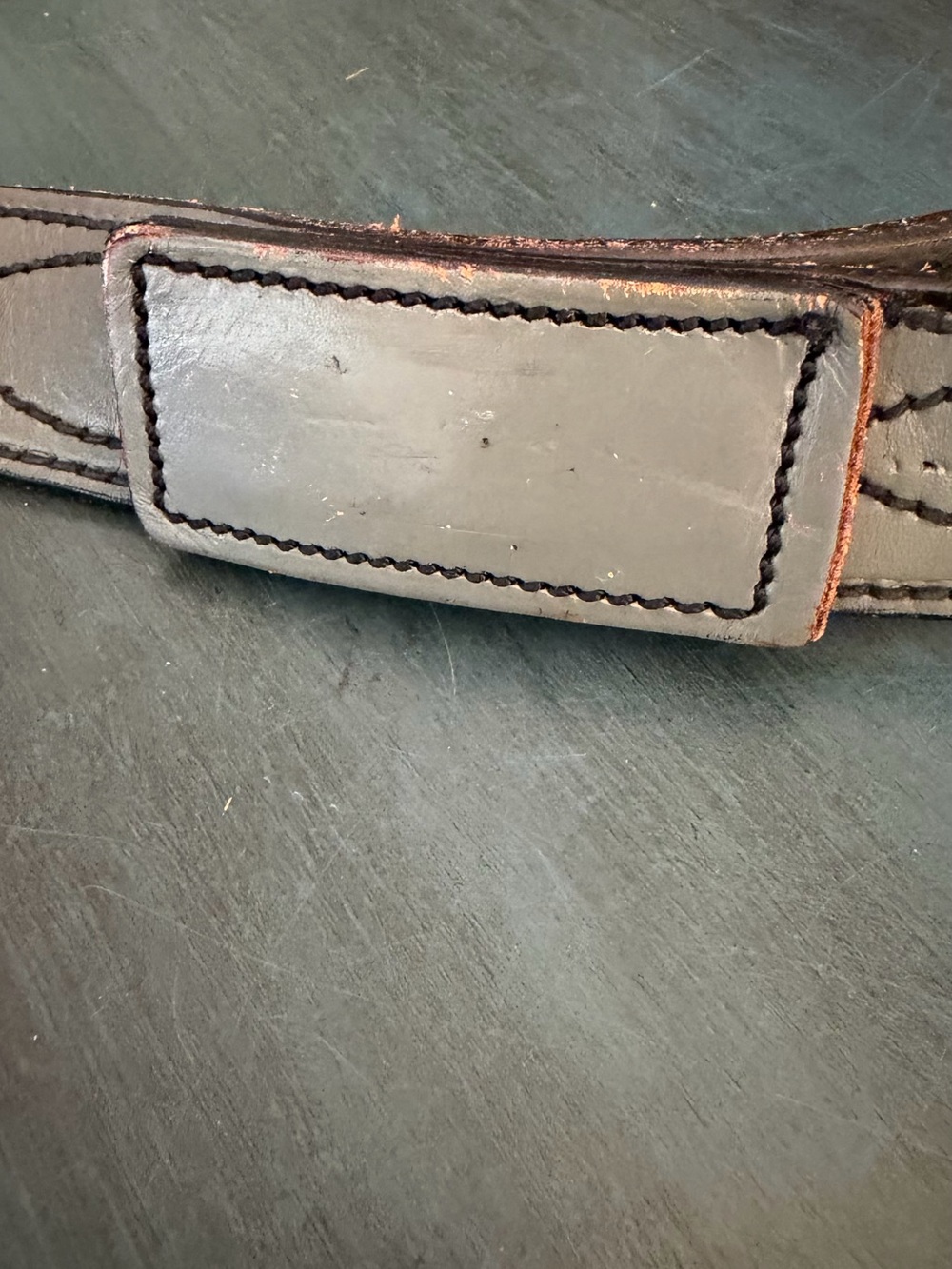 Grey Leather belt with rectangular buckle wrapped in matching leather